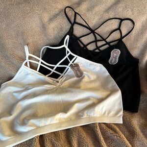 New with tags pair of crop camisoles with cross cross detail